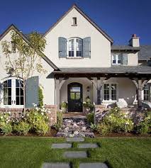 Farmhouse paint colors white stucco house. English Style Home With White Stucco And Red Bricks In 2021 Brick Exterior House Modern Farmhouse Exterior House Paint Exterior