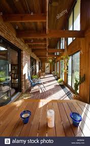 Interior View Of The Atrium Solarium In A Passive Solar Envelope House Design Home In Residential Neighborhoo Earthship Home Modern House Plans Solar House