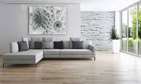 A tactile rug on top of a wood floor adds a layer of interest and comfort to a living room. 9 Principles Of Minimalist Interior Design To Increase Space And Joy In Your Home