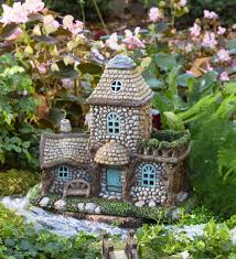 A fairy garden is a miniature garden complete with structures and actual living plants. Miniature Garden Lighted Stone Fairy House Plowhearth
