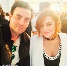 Lohan shows off skinny legs in London almost 1 YEAR after leaving rehab