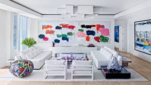 This white shiplap wall is the perfect way to break up a large room without adding any extra color. 13 White Living Rooms Architectural Digest