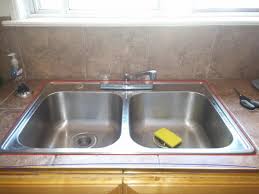 where to caulk this kitchen sink (with