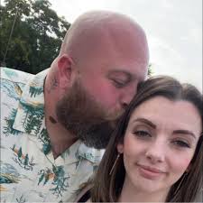 What medium-sized social breed dog can help protect a herd of goats?