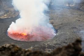 Nyiragongo volcano is one eight volcanoes in the virunga range, african rift valley. Africa Democratic Republic Of Congo Virunga National Park Man Sittiing Over Nyiragongo Volcano Crater Stockfoto