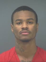 Woman arraigned in Milton drive-by shooting