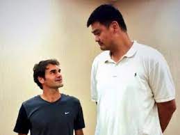 We have been staring at this photo for about a hour straight, and it keeps getting better. Yao Ming Dwarfs Dallas Mavericks Luka Doncic Dirk Nowitski Nba Basketball Cairns Post