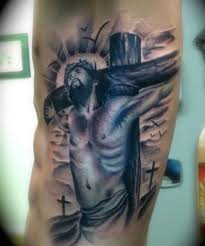 A tattoo in which the cross is drawn and given the effect of wood. Pin On My Findings