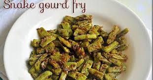 Easy Snake Gourd Fry Pudalangai Poriyal Without Coconut Poriyal Recipes Recipes Food Green Vegetable Recipes