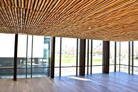 Wooden ceilings have long been regarded as the elite choice for ceiling design, due to their infinite coffered and patterned or horizontally planked, the wood ceiling adapts to any home and interior. Wavy Wood Ceilings Nach Spring Valley Archello