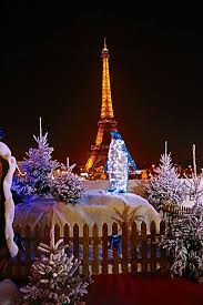 Eiffel tower with christmas tree decoration on white background. Eiffel Tower At Christmas Time Pinspopulars Christmas In Paris Paris Tour Eiffel Eiffel Tower