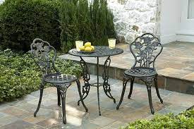 The smoked glass table top adds an earthy tone and is easy to maintain. Cast Iron Patio Set Table Chairs Garden Furniture Outdoor Furniture Ideas Patio Furniture Wrought Iron Iron Patio Furniture Outdoor Patio Chairs Vintage Patio