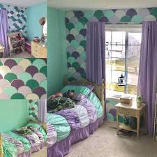 The moody bedroom is deeply relaxing, with deep purple walls, black bedroom furniture and hits of metallics that pick up the light. Girls Bedroom Diy Mermaid Theme Bedroom Purple Aqua Teal Lavender Room Scale Wall