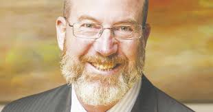 Council lowers tax rate, seeks community's trust