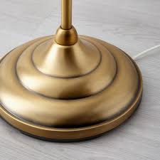 The simple, oversized metal shape is inspired by old lamps from places like factories and theaters. Arstid Floor Lamp With Led Bulb Brass White Ikea