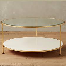 Heath ceramics bud vase in cool lava, $52, heathceramics.com. Anthropologie Lacquered Brass Round Coffee Table Arie Co