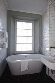 Check out this gallery of 36 modern bathroom designs that use white and gray decor along with wood tone, greenery and contemporary bathroom lighting. 100 Small Bungalow Bathroom Ideas Small Bathroom Bathroom Design Bathrooms Remodel