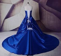 If you're searching for a romantic look for your wedding day, try a floral lace gown with a sweeping train. Plus Size Royal Blue Wedding Dress With Court Train White Lace Detai