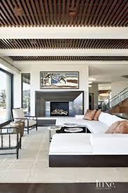 A Modern Hillside Laguna Beach Dwelling With A Resort Style Feel Luxe Interiors Design Fireplace Design Modern House Design Modern Interior Design