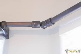 We have a bay window in our dining area. Diy Bay Window Curtain Rod All Things Thrifty