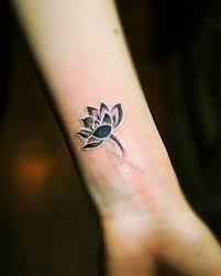 Lotus Flower Might Also Look Good On The Hip Or Just Below The Insde Of The Elbow Tribal Flower Tattoos Tattoos Small Tattoos
