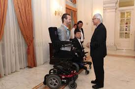 President Tony Tan (4th from left) conversing with Nick …