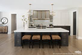 The transitional space opens up to a large dining area with plenty of natural light from an array of windows. Modern European Open Concept Kitchen Nkba
