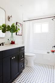 Design Ideas For A Transitional Bathroom With Shaker Cabinets Black Cabinets An Alcove Tub Bathroom Floor Tile Small Bathroom Flooring Bathroom Inspiration