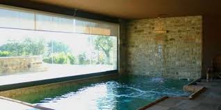 In the backyard area of the swimming pool, there is a place for sunbathing to dry off after swimming. Small Indoor Swimming Pool Design Ideas Savillefurniture