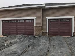 this is c h i overhead doors 4283 r value of 9 65 mahogany in color with arched stockton windows overhead door garage door design painted front doors