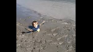 kid gets trapped in deep quicksand