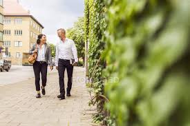 Maybe you would like to learn more about one of these? Senior Man And Woman Walking On City Street Free Time Pavement Stock Photo 199976078