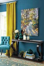 Placee autour dune table a la teinte sombre cette chaise bleu canard apportera une touche de couleur tout en offrant une assise supplementaire. Salon Bleu Et Jaune 17 Idees Deco Pour Associer Ces Couleurs Deco Bleue Idee Deco Salon Chaleureux Deco Salon