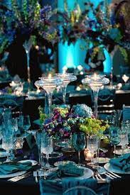 Acrylic gems accent the tail feathers, which adds a lustrous gleam among more matte decorations. Sparkling Tables For New Year S Day Trendy Home Decorations Peacock Wedding Theme Peacock Wedding Decorations Wedding Decorations