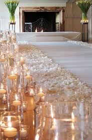 Ivory Rose Petal And Floating Candles Down A Wedding Aisle For The Bride On A Budget Diy Princess Que Wedding Aisle Decorations Aisle Candles Wedding Lights
