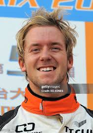 British driver Sam Bird stands