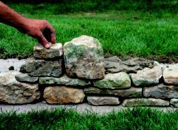 Use a trowel and tool the mortar butter the ends of the stone. How To Build A Stone Garden Wall Ideas Advice Diy At B Q