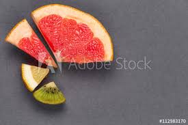 Pie Chart Of Fresh Vitamin Fruit On Gray Textural Background