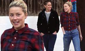 The couple was recently spotted arriving at los angeles international airport. Amber Heard Cuts A Casual Figure As She Steps Out With Girlfriend Bianca Butti In La Daily Mail Online