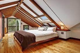 A canopy bed fits right in this attic bedroom with vaulted ceilings. Convert Your Attic Into A Bedroom