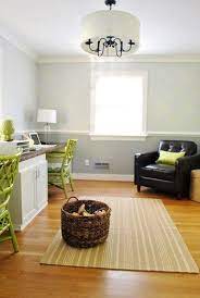 A chair rail (with beadboard wainscoting) is painted a dark green in master mix: Grounded Painting The Wall Under Our Chair Rail Darker Young House Love Dining Room Paint Dining Room Colors Dining Room Paint Colors
