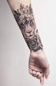 Next Tattoo Lioness Wearing A Crown Adding Flowers To It Tattoos Lion Tattoo For Women Hand Tattoos For Women