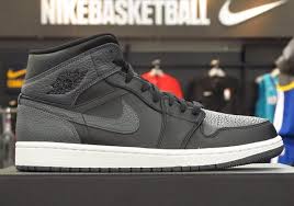 Black And Gray Air Jordan 1 Mid The Air Jordan 1 Mid Appears In Attractive Tumbled Leather 554724 041 Sneakernews Com Air Jordans Jordan 1 Mid Jordans