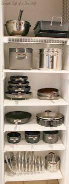 Keep everything tidy and make use of some extra kitchen square footage while hang your pots and pans from hooks and outline them in chalk so you never forget where each item lives. 45 Best Small Kitchen Storage Organization Ideas And Designs For 2021