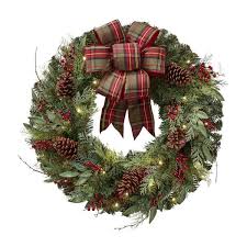 The tradition really started with the celts they used boughs of holly to decorate their doors to celebrate the return of the sun or the birth of a god. 45 Best Christmas Wreaths Stylish Christmas Wreath Ideas