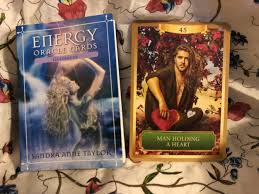 Then put all the piles back together and shuffle. Energy Oracle Cards Man Holding A Heart Lili Loves