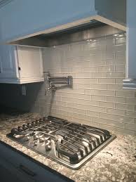 Bianco Antico Granite Mist Glass Tile Backsplash White Cabinets 5 Burner Ge Glass Tile Backsplash Kitchen Kitchen Tiles Backsplash Glass Backsplash Kitchen