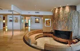 Curved Modern Sunken Living Room With Circular Slate Fireplace And Hickory Wood Floors Sunken Living Room Best Living Room Design Living Room Remodel
