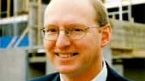 Businessman's accused killer breaks down in court