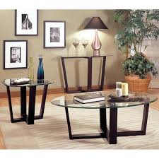 The design is contemporary, and the translucent top shows off the ironwork to best the tables are all made in a similar fashion out of wrought metal with a top surface made in a round shape out of glass. Glass Top Coffee Table With Metal Base Ideas On Foter